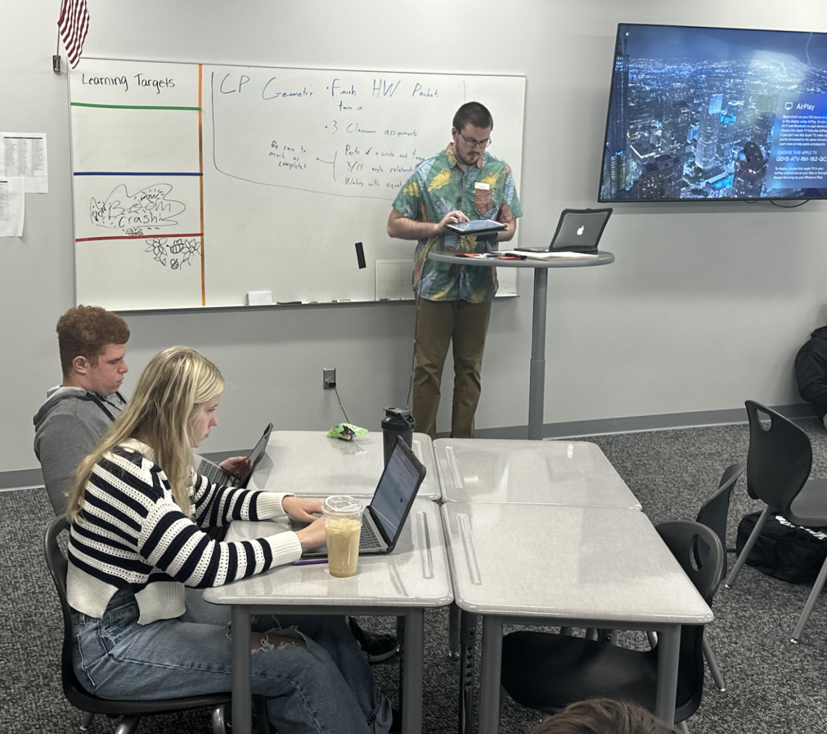 In April Martins CP Geometry class, student teacher Connor Grant goes over notes from the lesson. In addition to being a Gretna alum, Grants sister, freshman Morgan Grant, is in Martins CP Geometry class.